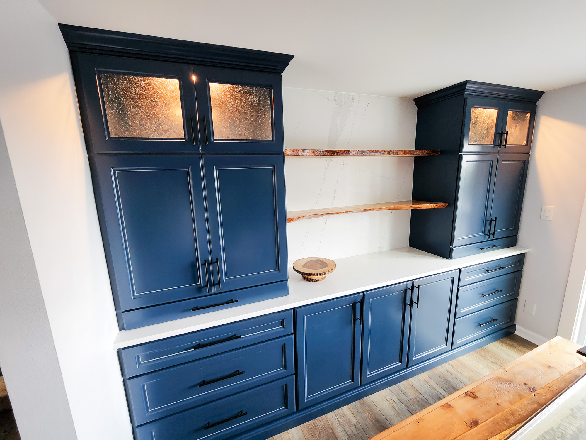Blue kitchen cabinets custom built to fit a whole wall